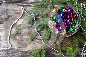 Colorful Christmas balls on wooden background