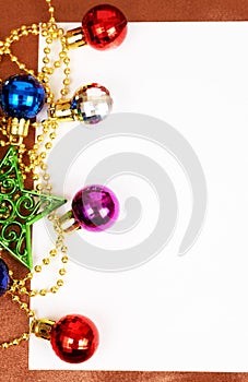 Colorful Christmas baubles and card