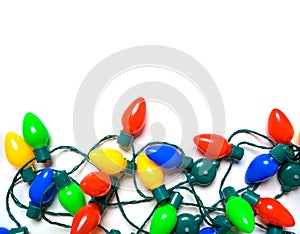 Colorful Christmas lights on a white background