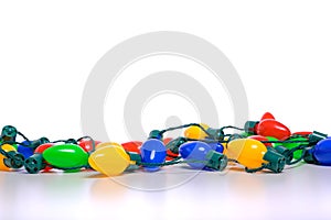 Colorful Christmas lights on a white background