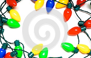 Colorful Christmas lights on a white background