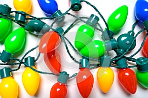 Colorful Christmas lights on a white background