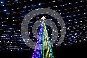 Colorful Christmas tree with light power lines with star at the top at Remate de Paseo Montejo, Merida, Yucatan, Mexico