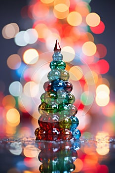 a colorful christmas tree made out of plastic beads