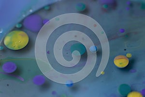Colorful circles with fluid turquoise blue background