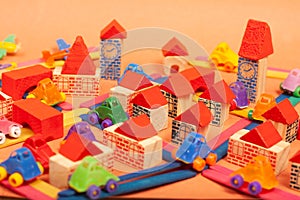 Colorful city on a orange background toys cars aeroplanes houses