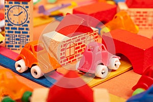 Colorful city on a orange background toys cars aeroplanes houses