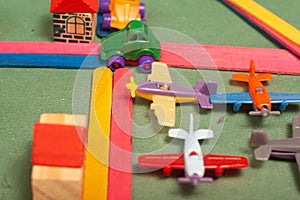 Colorful city toys cars aeroplanes houses