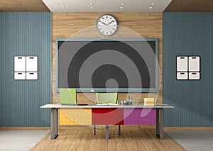Colorful classroom without students with blackboard and teacher\'s desk