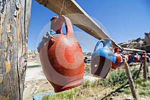 Colorful clay jugs hanging in a line, Cappadocia, Turkey