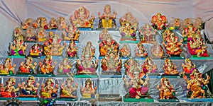 Colorful clay made idols of Hindu god Lord Ganesha ready for sale at a stal