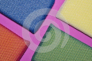 Colorful cleaning sponges arranged in diagonals.