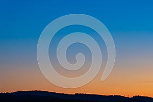 Colorful clear sky with no clouds at dusk after sunset