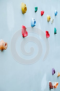 Colorful climbing holds on wall
