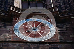 Colorful clock in tower of Freiburg Cathedral