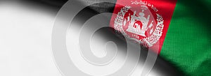 Colorful, closeup, wavy fabric flag of Afghanistan on white background - right top corner flag