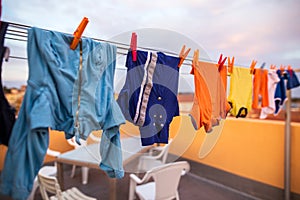Colorful clothes hanging on rope