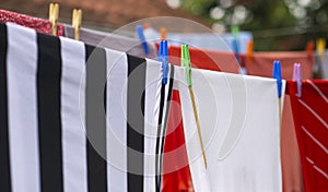 Colorful clothes hanging to dry on a laundry line