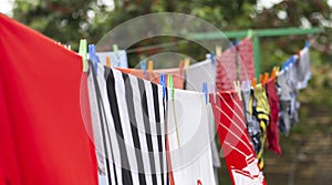 Colorful clothes hanging to dry on a laundry line