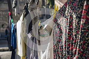 Colorful clothes hanging to dry on a laundry line in a sunny day in Jerusalem