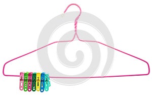 Colorful clothes Pegs clamped to pink hanger isolated