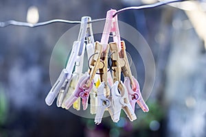 Colorful clothespin or clothes peg or clothes clip on a clothesline with a blurred background. photo