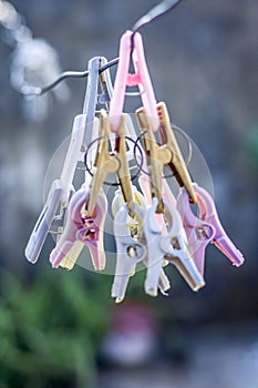 Colorful clothespin or clothes peg or clothes clip on a clothesline with a blurred background. photo