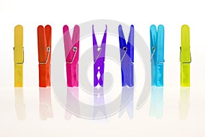 Colorful clothespin in a row photo