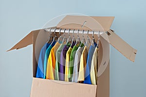 Colorful clothing in a wardrobe box for moving