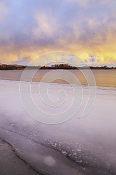 Colorful Clouds over a frozen Colorado Lake