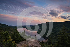 Colorful clouds over Jordan Pond overlook from North Bubble in Acadia National Park