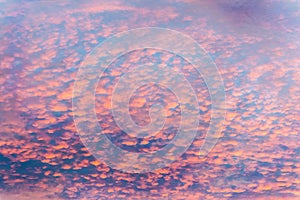 Colorful clouds in the sky with bright pinks over outback Australia, like a painting