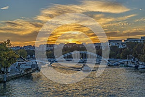 Colorful Clouds During Sunset Over Paris Seine River and Boats Cruises