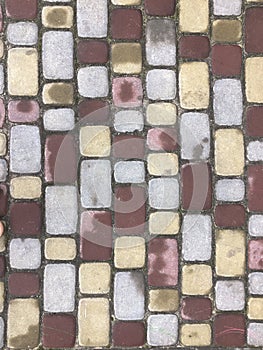 Colorful cobblestone road pavement, background photo texture