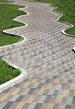 Colorful cobblestone road pavement, background photo texture