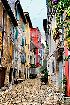 Colorful cobblestone street in the Old Town of Rovijn, Croatia