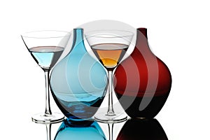 colorful cocktail drinking glasses and blue red special bottles