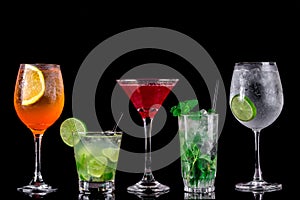 Colorful cocktails on black background