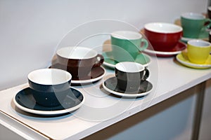 Colorful coffee cups lined up on the table