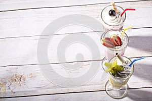 Colorful, cold frappes on wooden background photo