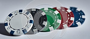 The colorful collection of poker chips arranged on a surface. AI generated image