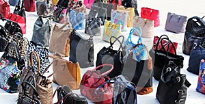 A colorful collection of women's handbags