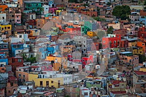 Colorful colonial crowd American city and buildings in hill, Guanajuato, Mexico