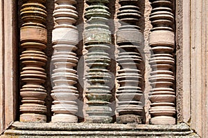 colorful column details at ancient stone temple in Burirum Thailand