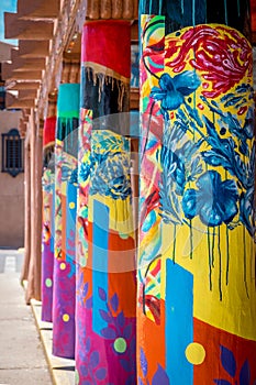 Colorful columns with blue flowers and abstract designs in Santa Fe New Mexico.