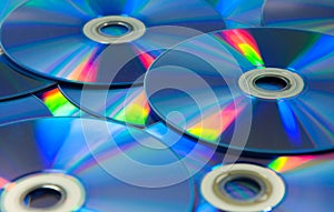 Colorful compact discs set of DVD scattered on a table
