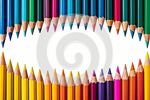 Colorful composition frame border made of vibrant pencils on white