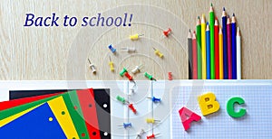 Colorful composition of school supplies and letters on the withe wooden background. Banner. Flat lay. Back to school