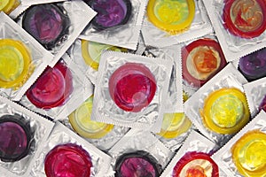 Colorful condom on background. large number of condoms. concept of safe sex. lots of rubber condoms. bunch of objects