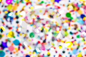 Colorful confetti defocused blur wallpaper. Holiday new year, birthday, wedding, christmas flat lay